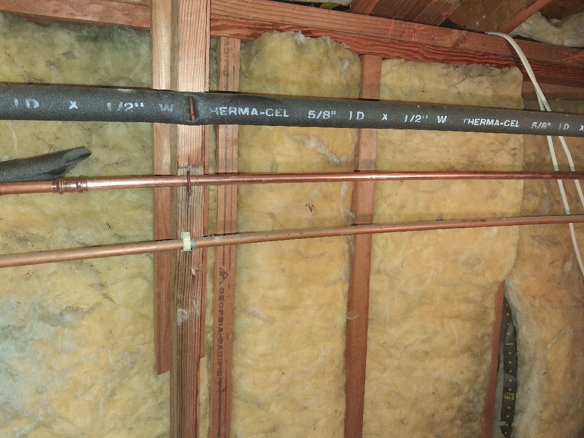 Localized replacement copper piping in an open ceiling access area.